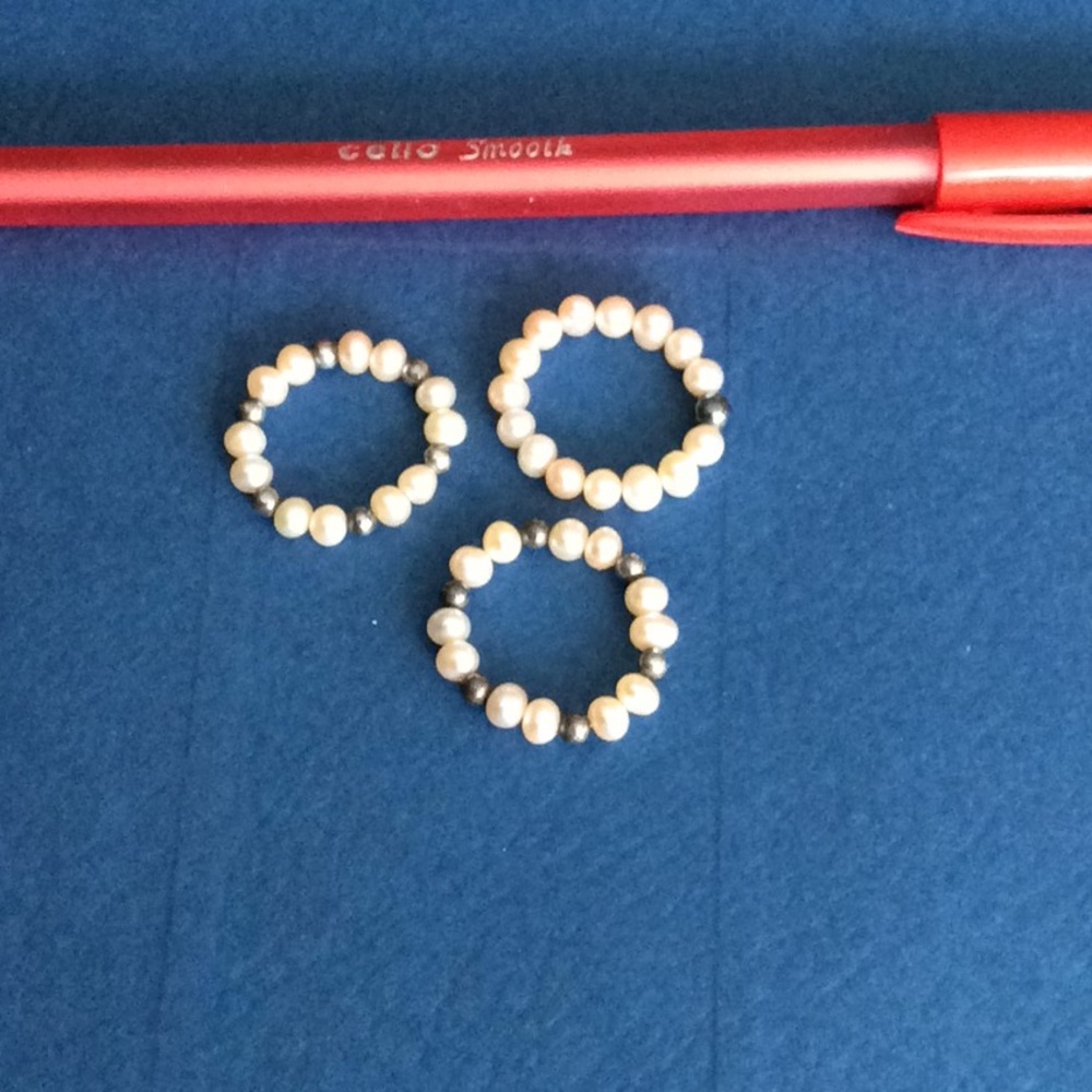 Set of three stretch pearl rings with silver beads